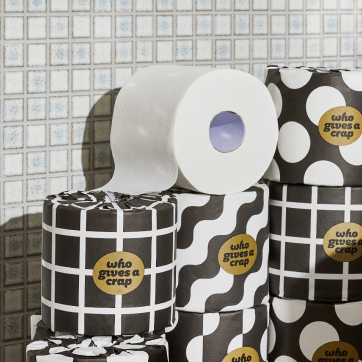 Stack of toilet paper with patterned wrappers.