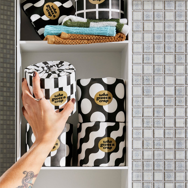 Stack of toilet paper with patterned wrappers.