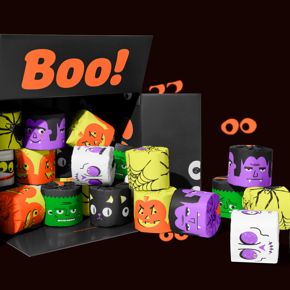 Box of Who Gives A Crap Spooky Edition toilet paper spilling out with bright monster wrappers