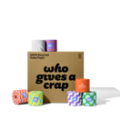 A large box of Who Gives A Crap 100% Recycled Toilet Paper with colorful wrappers - eco-friendly, biodegradable and sustainable toilet paper. Displays a badge stating 