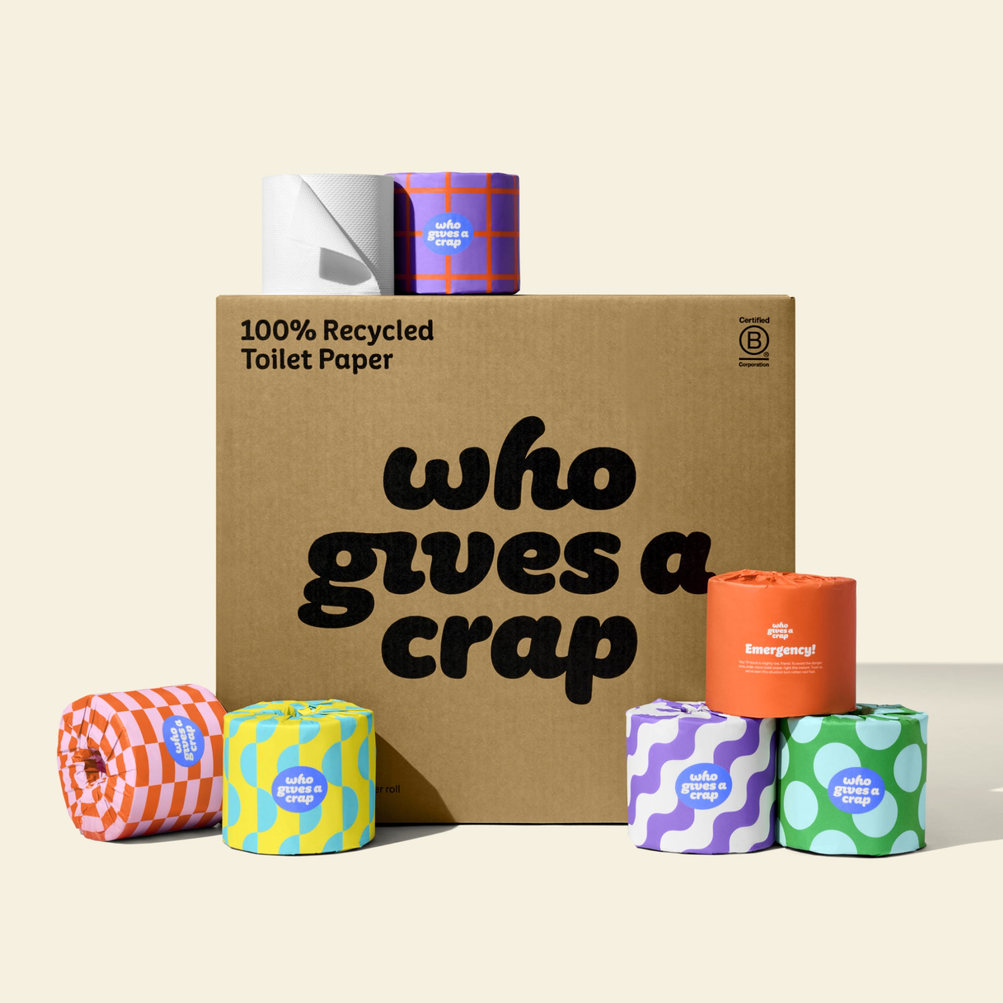 A large box of Who Gives A Crap Recycled Toilet Paper with colorful wrappers - eco-friendly, biodegradable and sustainable toilet paper