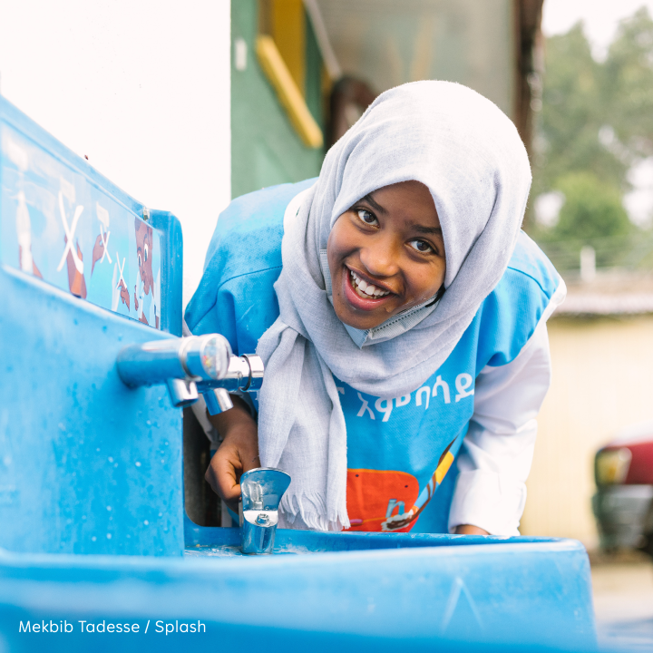 Close up of large rocks surrounded by a body of water