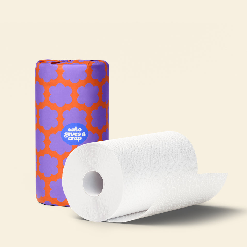Wrapped and naked rolls of Who Gives a Crap paper towel 