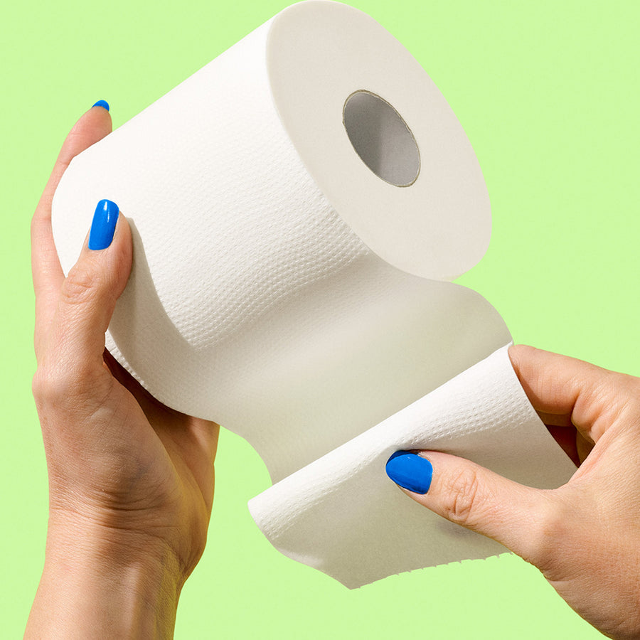 Hands holding a soft roll of bamboo toilet paper