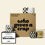 A large box of Who Gives A Crap 100% Bamboo Toilet Paper with black and white wrappers - eco-friendly, biodegradable and sustainable toilet paper. There is a badge stating "As Featured in The New York Times Wirecutter" 2025