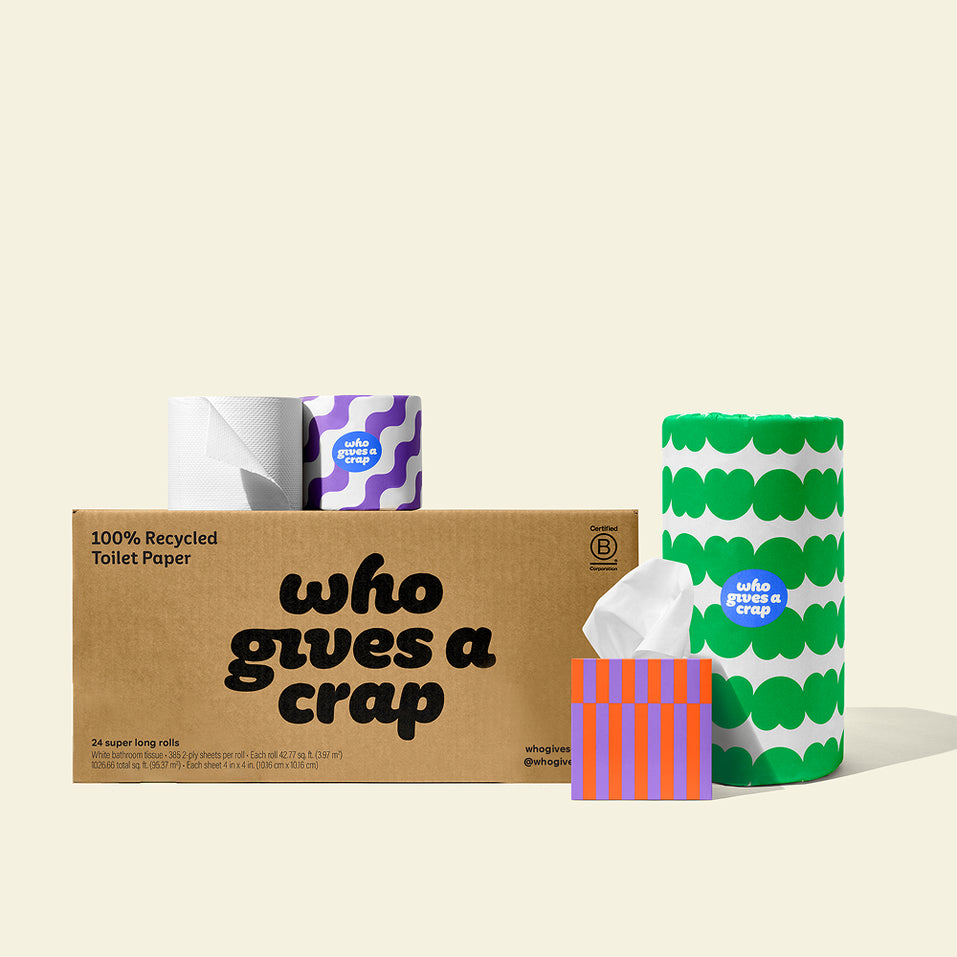 Bundle of Who Gives a Crap products with bamboo toilet paper, paper towel and tissues around a shipper box.
