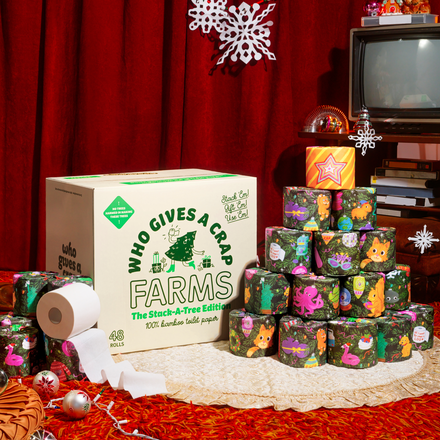 Stack-A-Tree Edition, a box of 48 toilet paper rolls wrapped with cheerful ornaments and stacked to create an eco-friendly tree.
